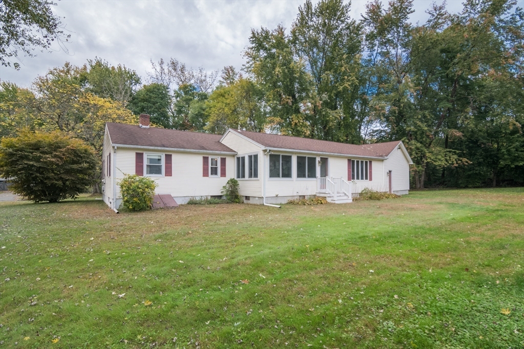 195 Mildred Avenue Springfield, MA 01104 - Photo 3 of 32 a front view of a house with yard and green space