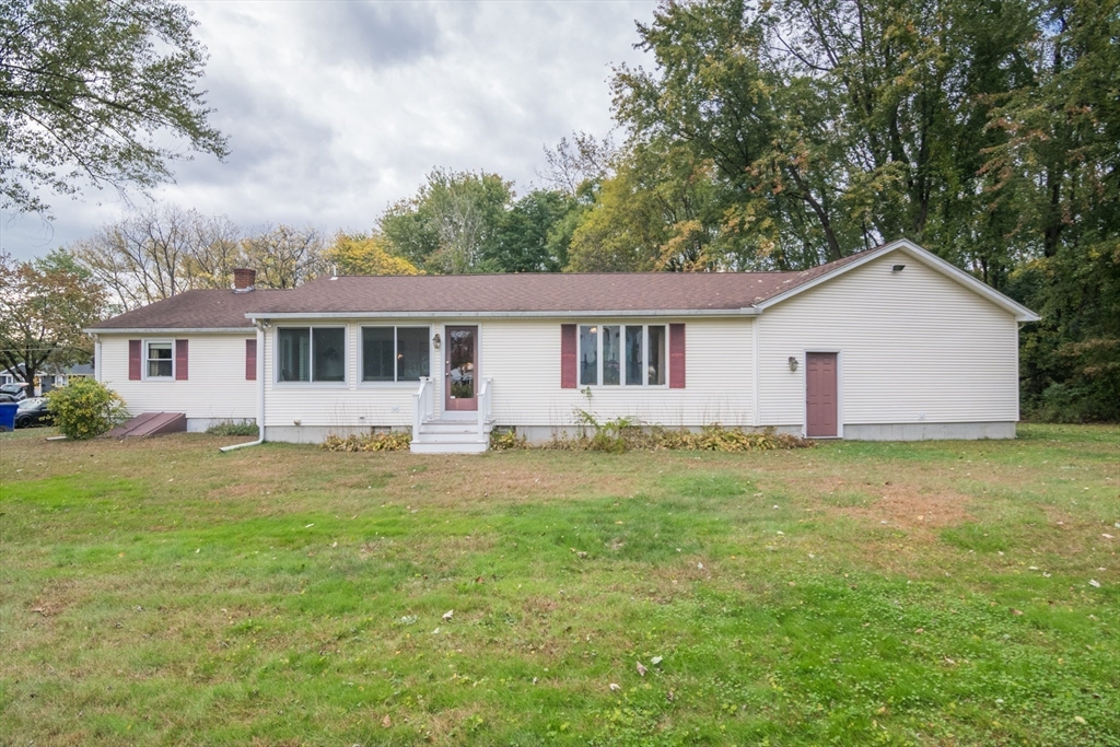 195 Mildred Avenue Springfield, MA 01104 - Photo 4 of 32 a view of a house with a yard