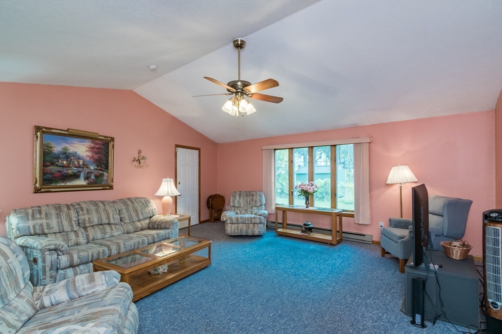 195 Mildred Avenue Springfield, MA 01104 - Photo 5 of 32 a living room with furniture flat screen tv and a large window