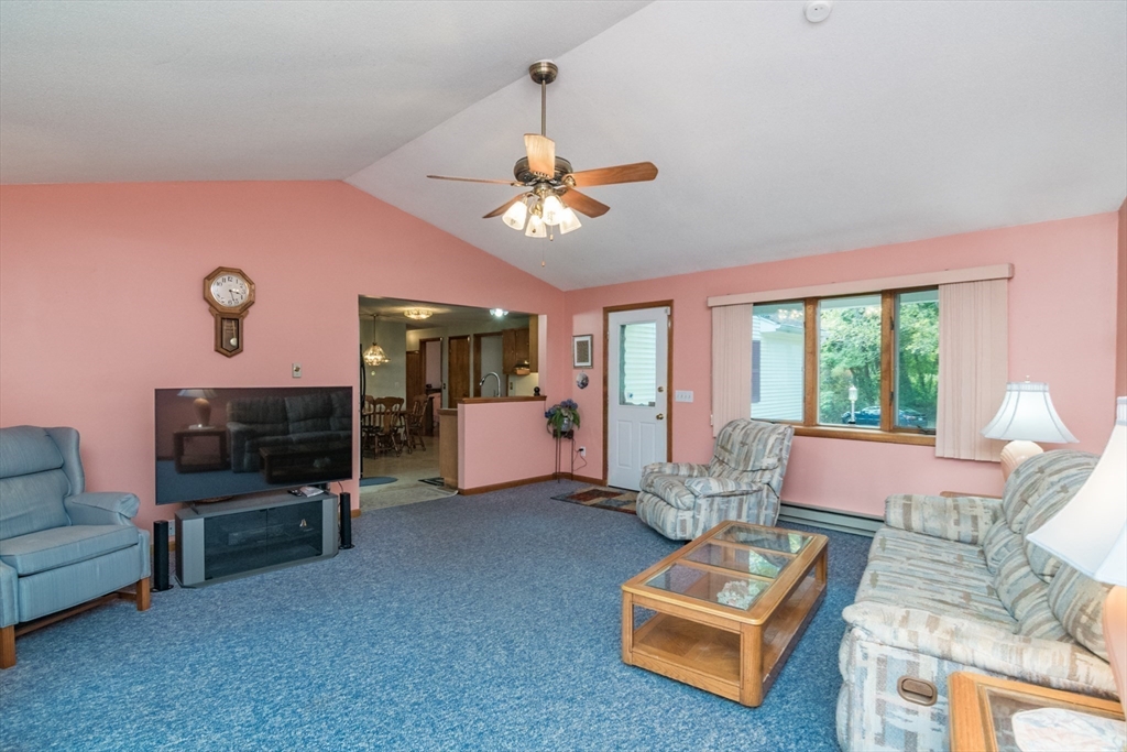 195 Mildred Avenue Springfield, MA 01104 - Photo 6 of 32 a living room with furniture and a floor to ceiling window