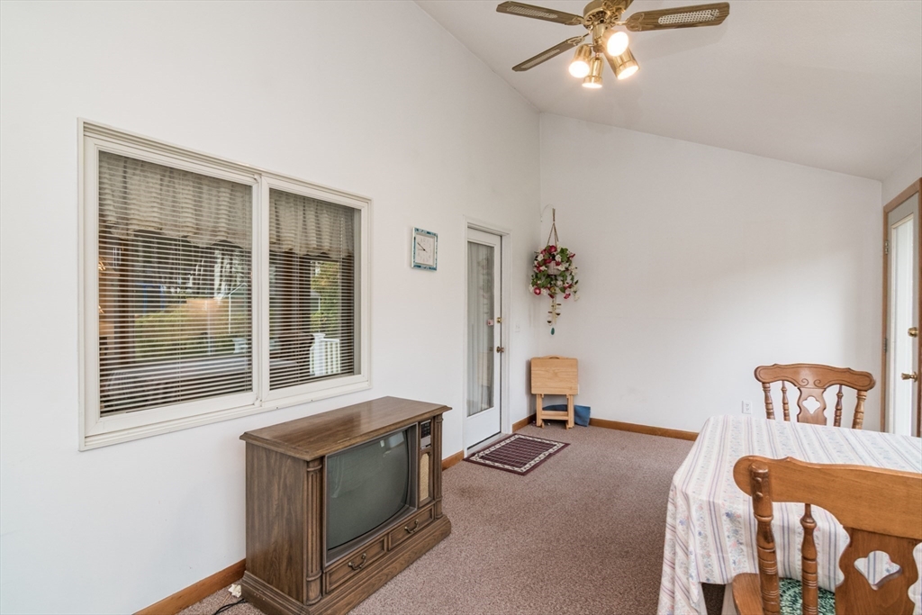 195 Mildred Avenue Springfield, MA 01104 - Photo 8 of 32 a living room with a bed furniture and windows