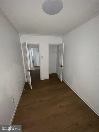 an empty room with a mirror