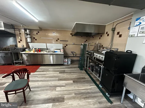 a room with lots of different furniture and clutter