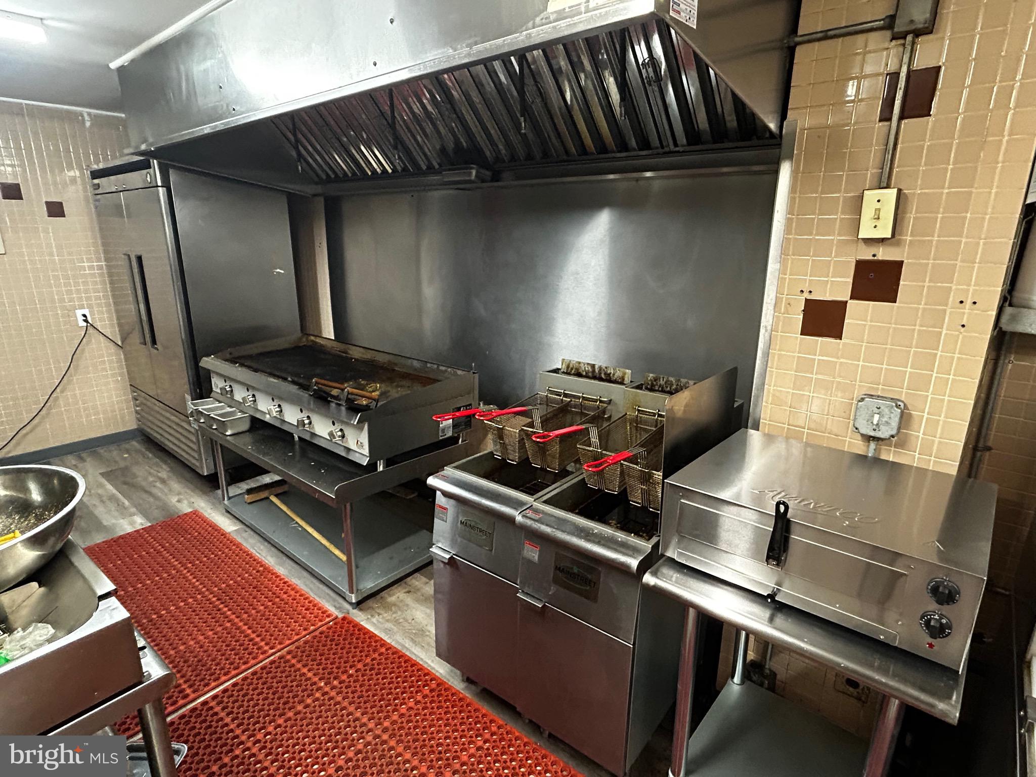 4655 Benson Street Philadelphia, PA 19136 - Photo 41 of 47 a stove top oven sitting inside of a kitchen