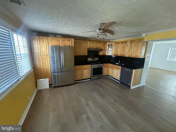 a view of a kitchen with a sink cabinets and a window