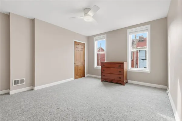 a bathroom with a tub shower vanity and a sink
