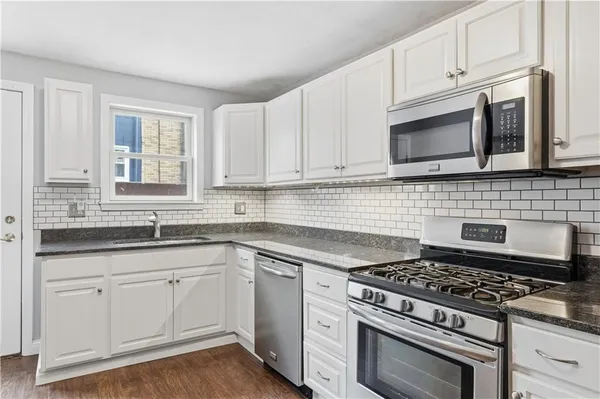 a room with furniture and a ceiling fan