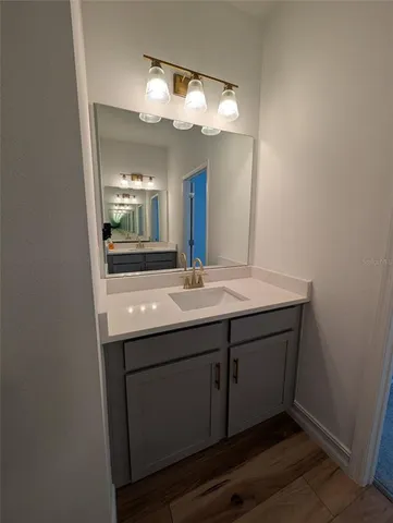 a bathroom with a sink and mirror