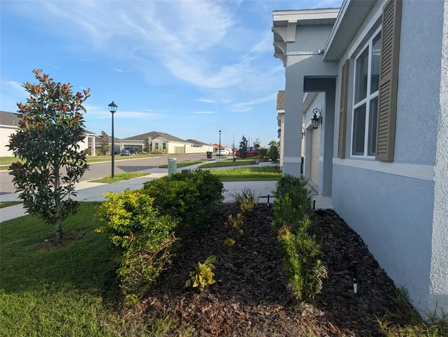 a view of a garden in front of the house