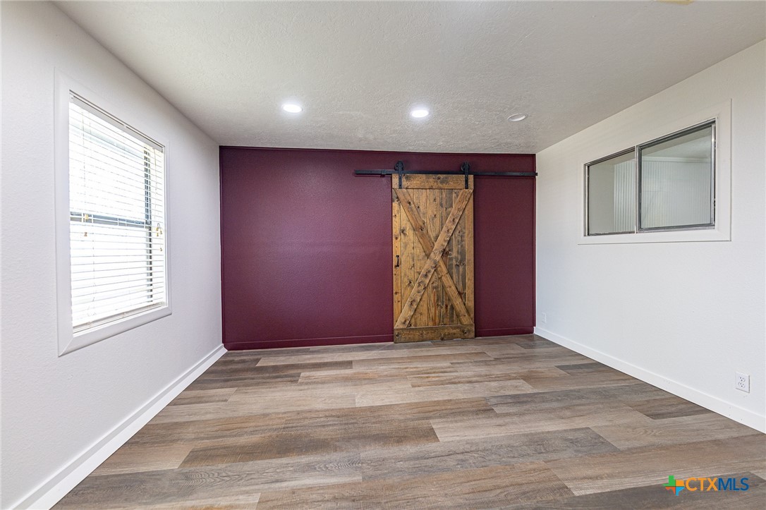 985 County Road 301 Shiner, TX 77984 - Photo 12 of 31 an empty room with windows