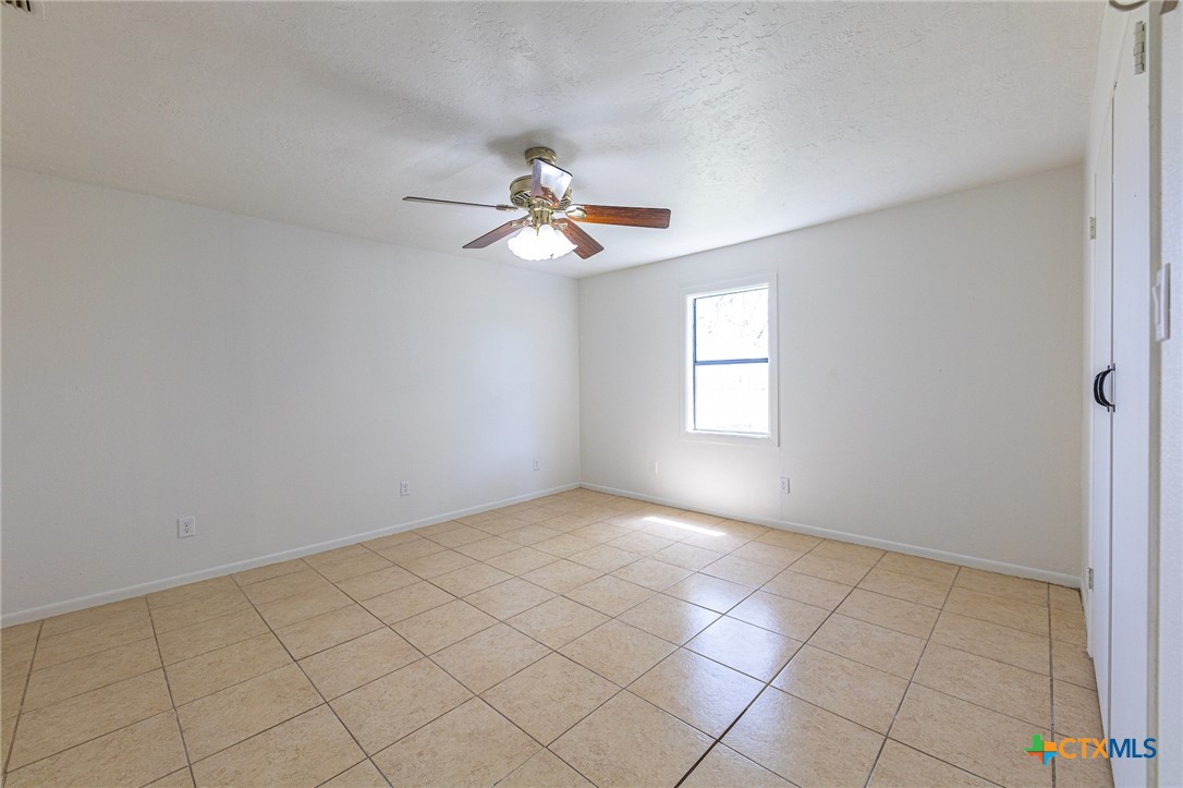 985 County Road 301 Shiner, TX 77984 - Photo 14 of 31 a view of an empty room with a window