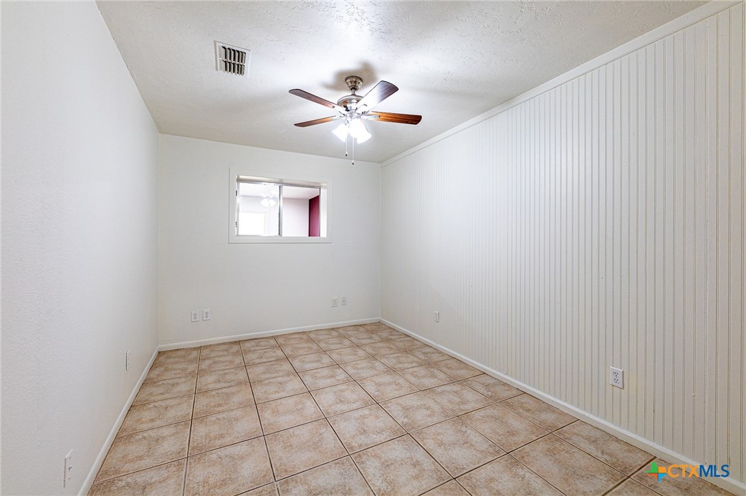 985 County Road 301 Shiner, TX 77984 - Photo 18 of 31 an empty room with windows and fan