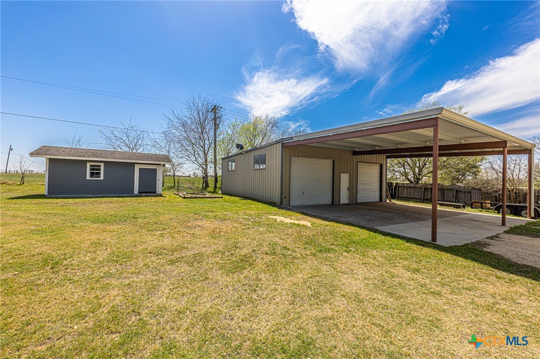 985 County Road 301 Shiner, TX 77984 - Photo 21 of 31 a view of a house with backyard and porch