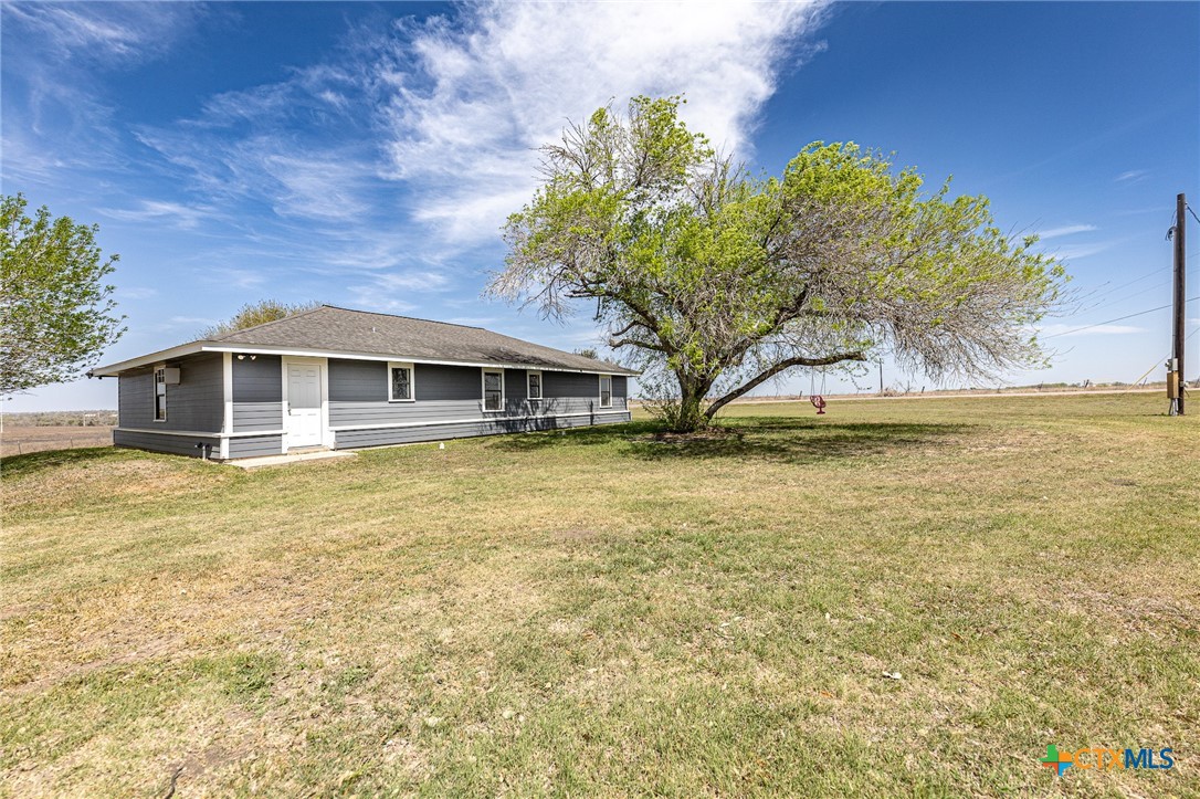 985 County Road 301 Shiner, TX 77984 - Photo 27 of 31 a house with swimming pool in front of it
