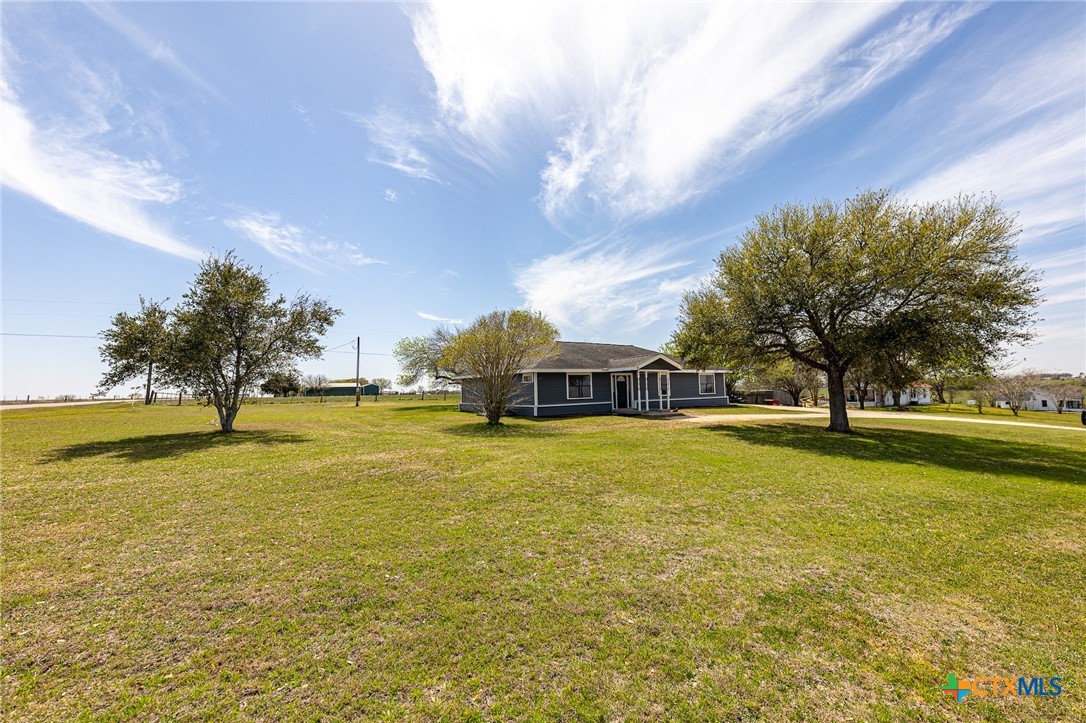 985 County Road 301 Shiner, TX 77984 - Photo 31 of 31 a house with swimming pool in front of it