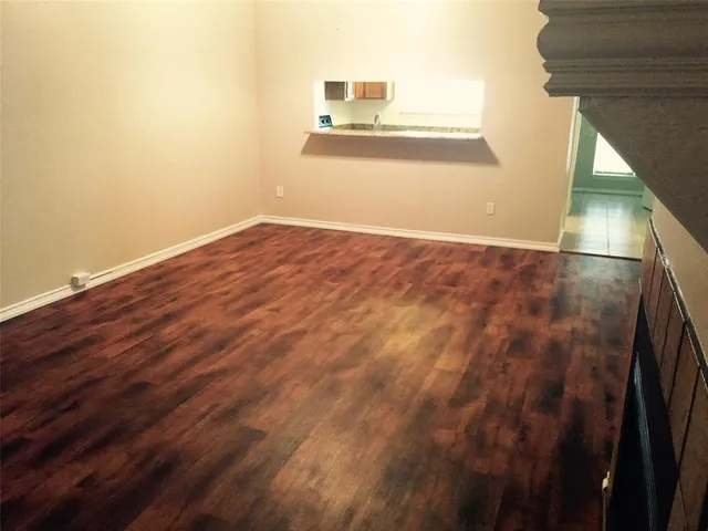 a view of a small space with wooden floor