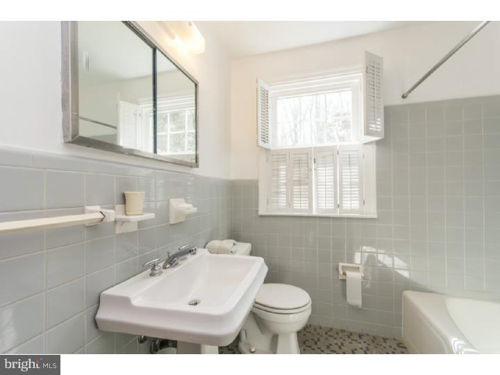 262 Devonshire Road Devon, PA 19333 - Photo 12 of 23 a bathroom with a sink toilet and mirror