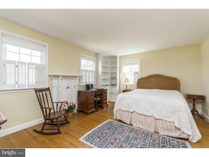 262 Devonshire Road Devon, PA 19333 - Photo 13 of 23 a bedroom with a bed and large windows