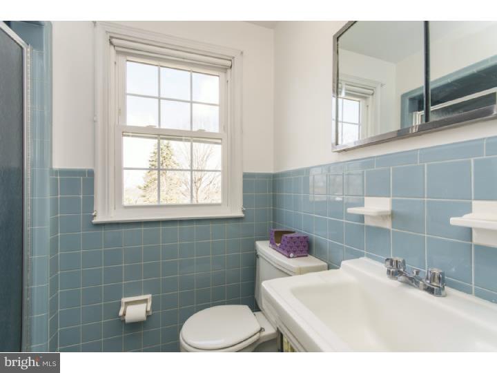 262 Devonshire Road Devon, PA 19333 - Photo 15 of 23 a bathroom with a sink toilet and window