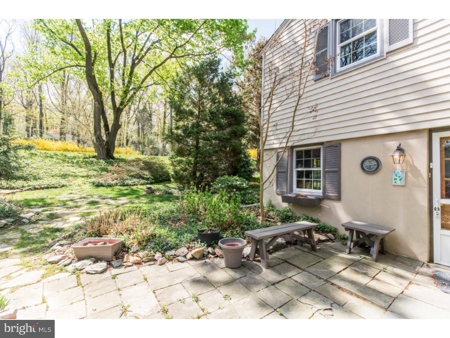 262 Devonshire Road Devon, PA 19333 - Photo 20 of 23 a backyard of a house with yard and outdoor seating