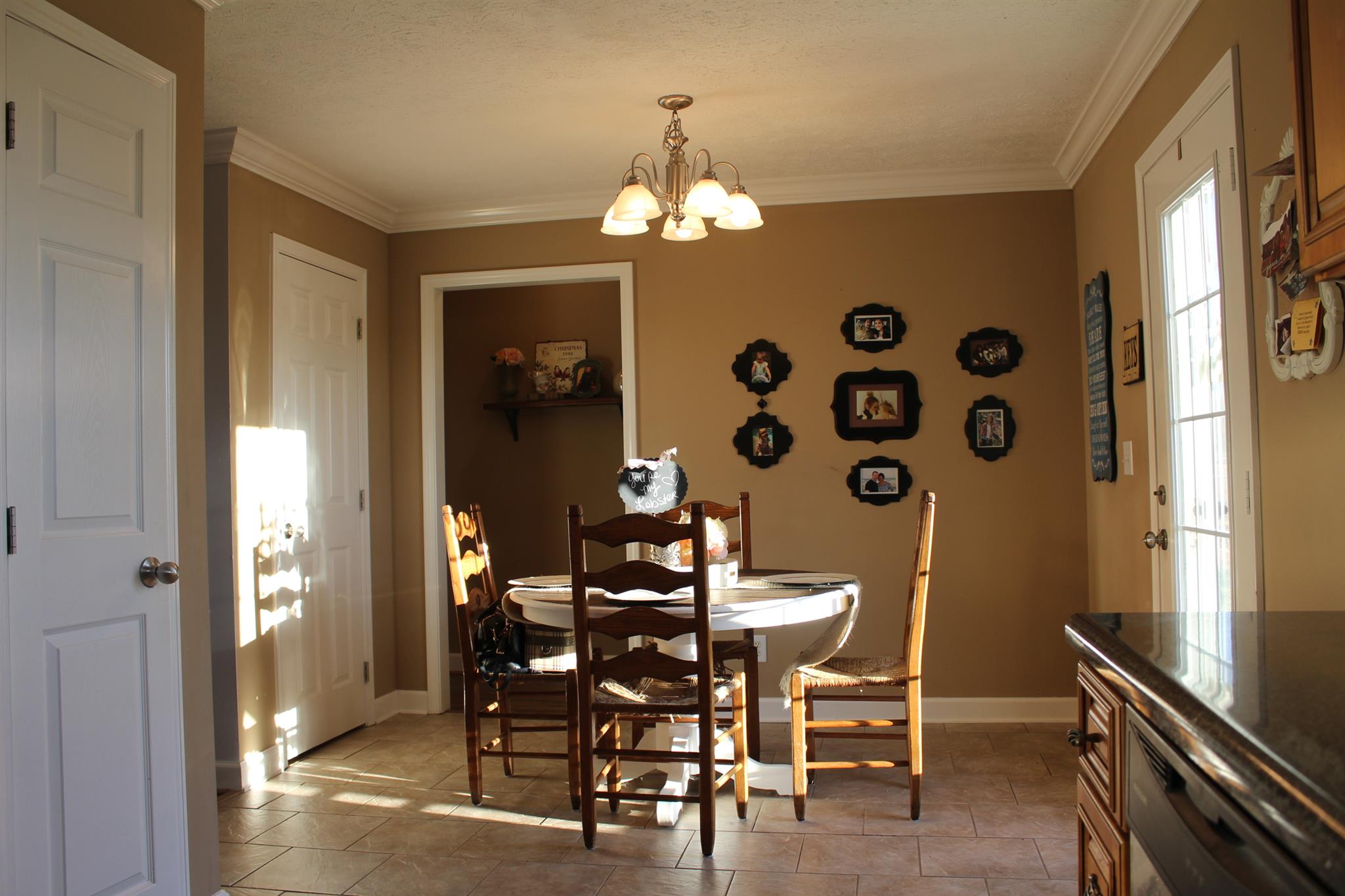 525 Martin Chapel Road Portland, TN 37148 - Photo 16 of 29 a view of a dining room with furniture and chandelier