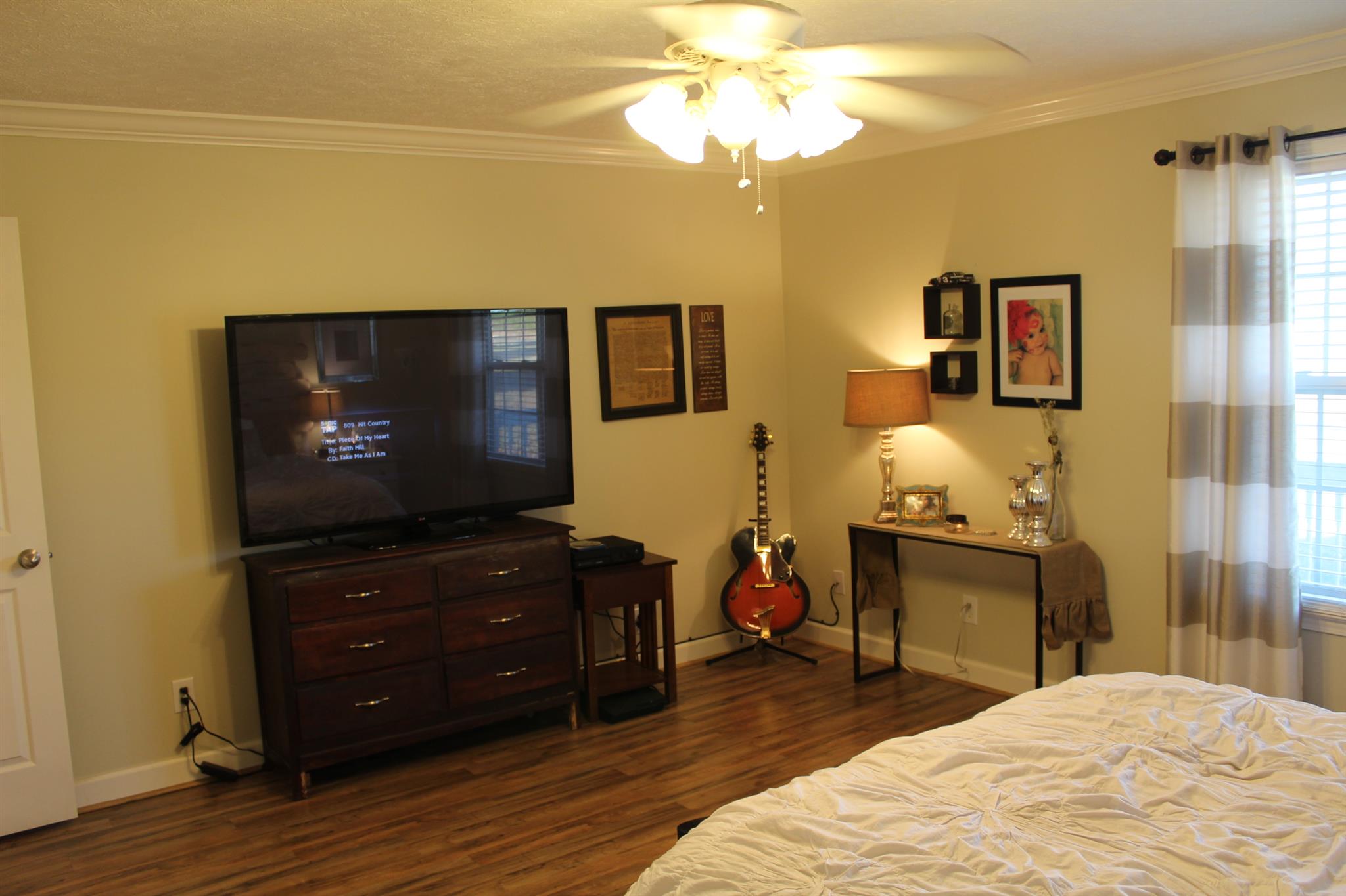 525 Martin Chapel Road Portland, TN 37148 - Photo 19 of 29 a bedroom with a bed and a flat screen tv