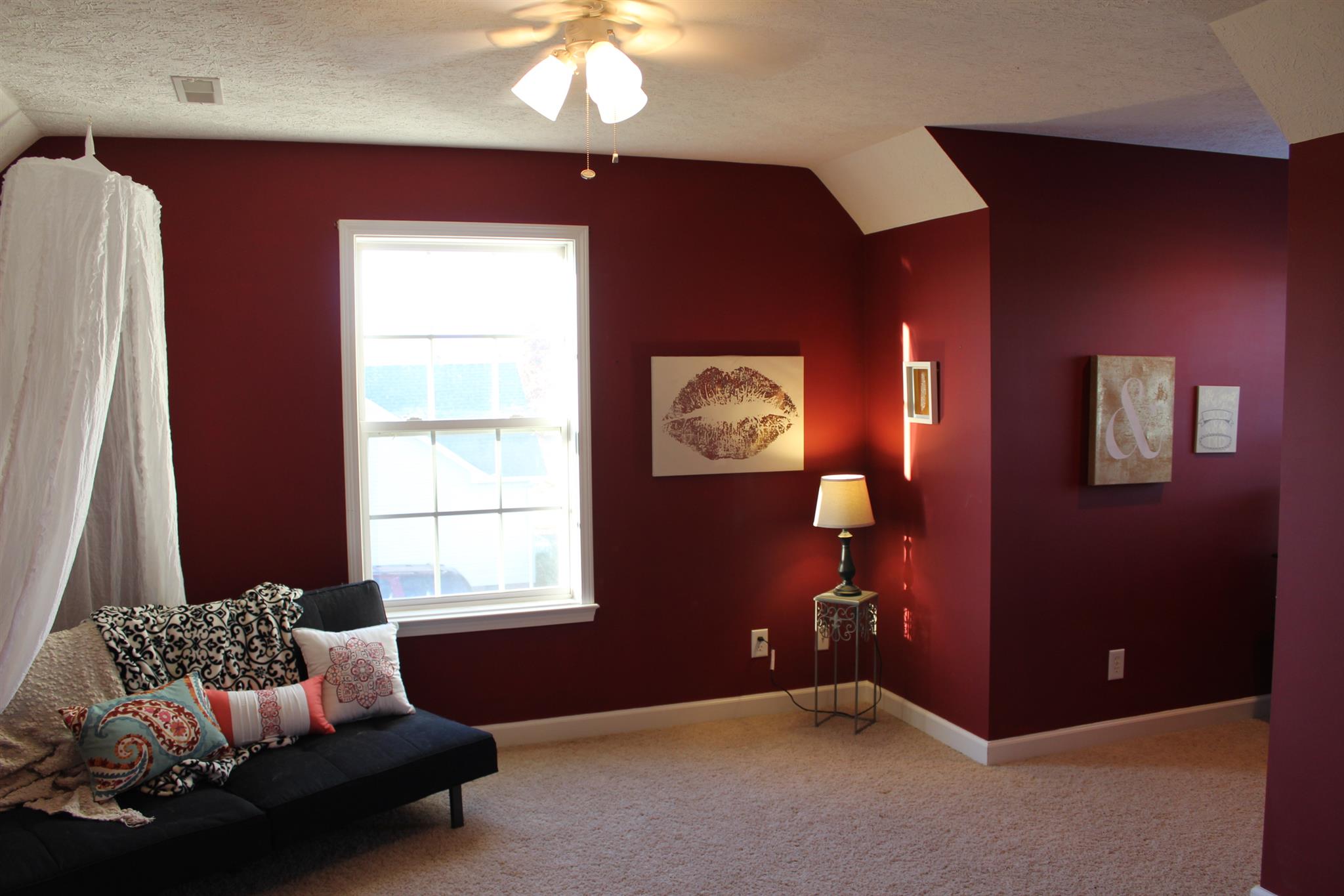 525 Martin Chapel Road Portland, TN 37148 - Photo 27 of 29 a bedroom with a bed and a chandelier