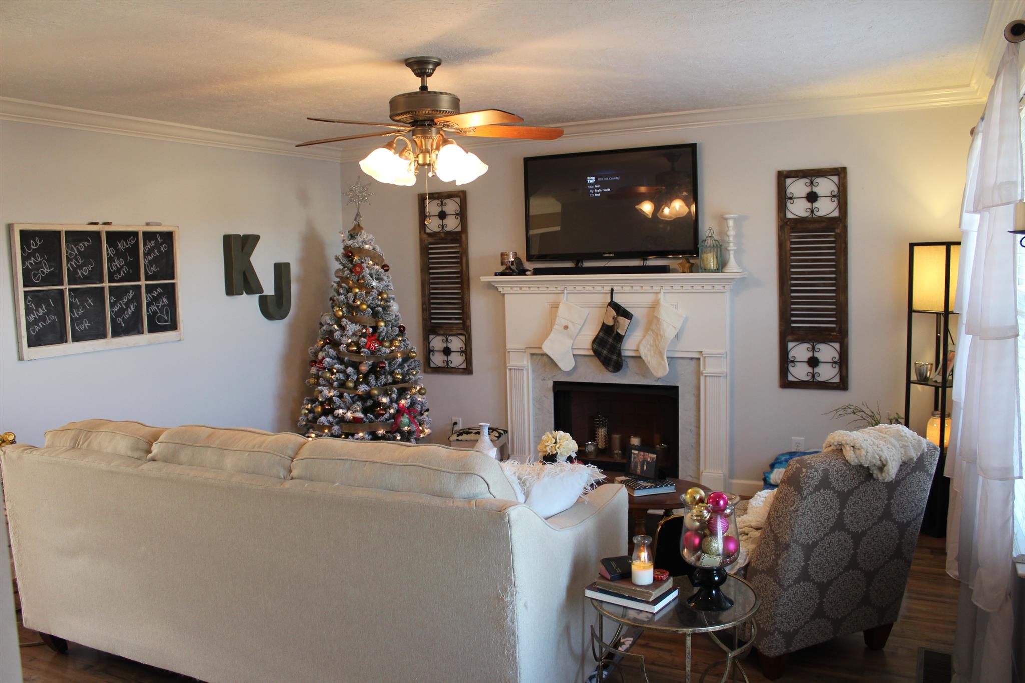 525 Martin Chapel Road Portland, TN 37148 - Photo 10 of 29 a living room with furniture a flat screen tv and a fireplace
