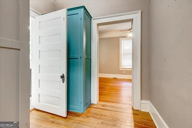 a view of a bathroom from a hallway