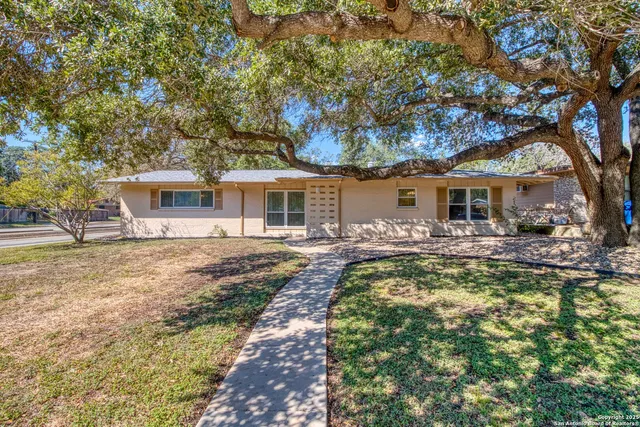 a front view of a house with swimming pool