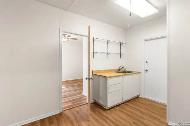 a view of cabinets and wooden floor
