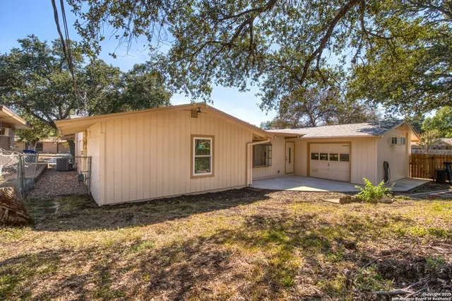 a house view with a backyard space