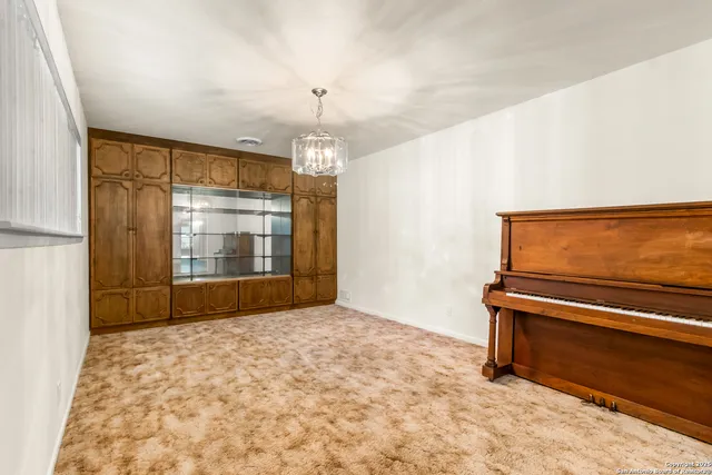 a view of room with window and hardwood floor