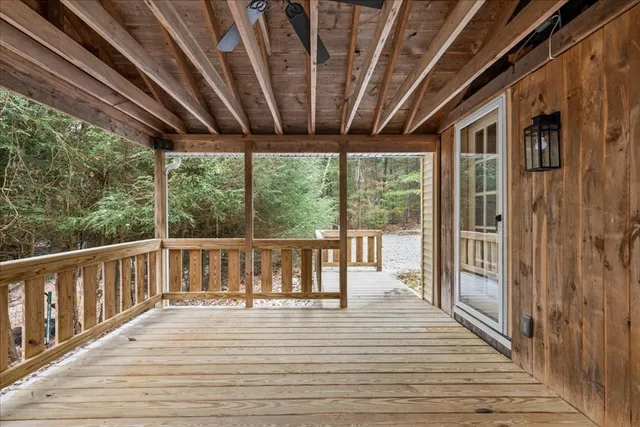 a view of balcony with wooden floor