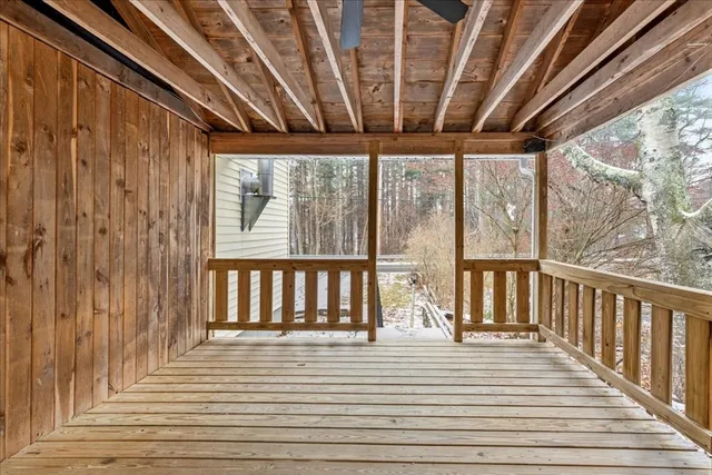 a view of balcony with wooden floor