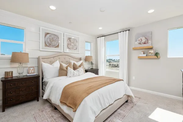 a bedroom with a bed and a cabinets