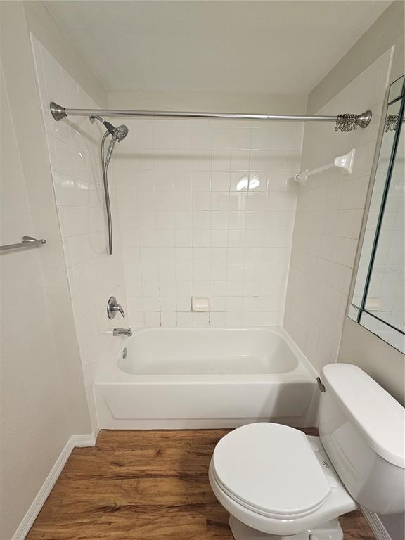 5174 Northridge Road, Unit 209 Sarasota, FL 34238 - Photo 14 of 25 a bathroom with a toilet and a shower