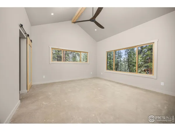 a kitchen with a sink cabinets and wooden floor
