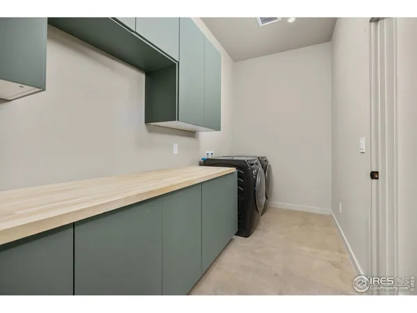 a bathroom with a toilet a sink a vanity and mirror