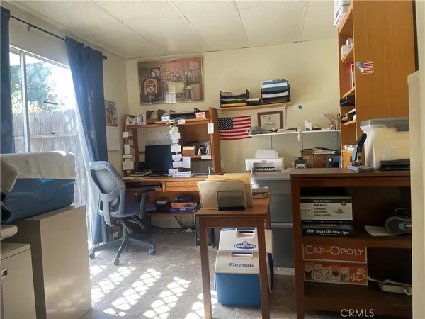a work room with furniture and a window