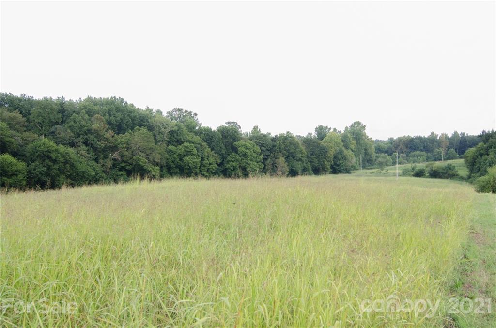 a view of a field with an outdoor space