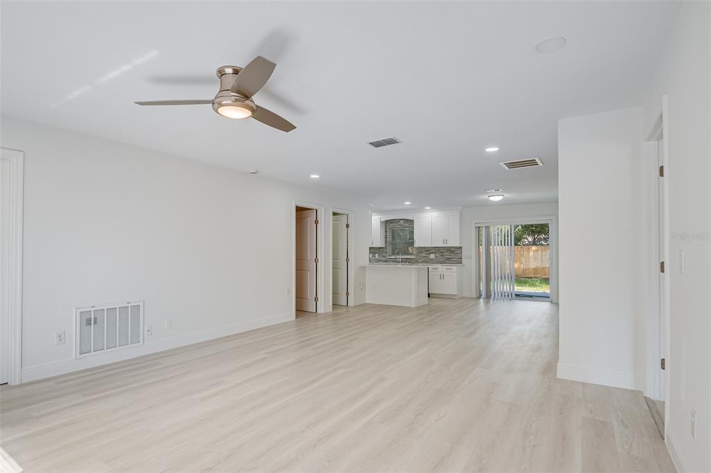1806 Forest Drive Oldsmar, FL 34677 - Photo 3 of 23 a view of empty room with wooden floor and window
