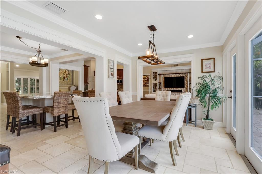 431 Ibis Way Naples, FL 34110 - Photo 14 of 37 a view of a dining room with furniture