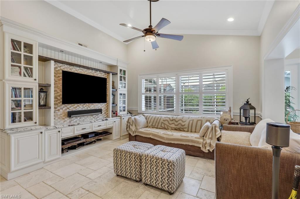 431 Ibis Way Naples, FL 34110 - Photo 17 of 37 a living room with furniture and a flat screen tv