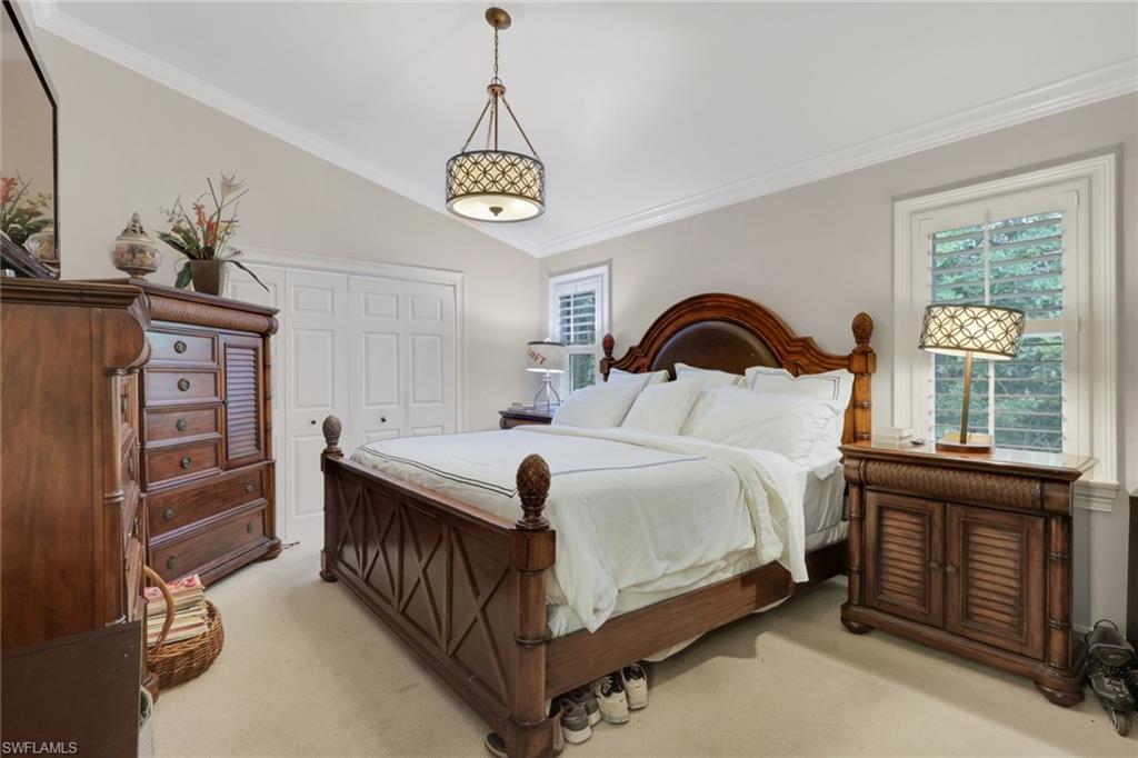 431 Ibis Way Naples, FL 34110 - Photo 28 of 37 a bedroom with a bed and a window