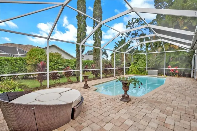 a view of a patio with table and chairs and potted plants