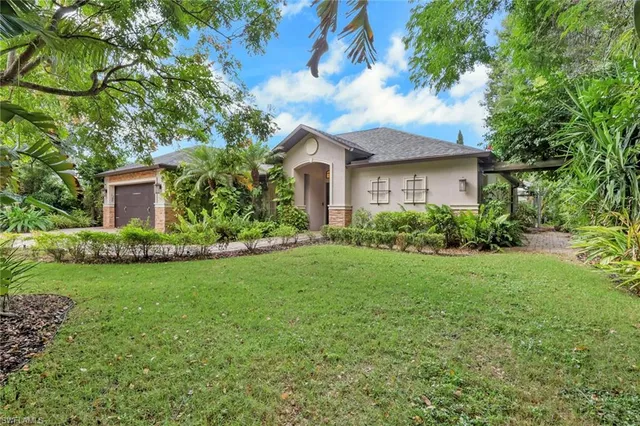 a front view of house with yard and green space
