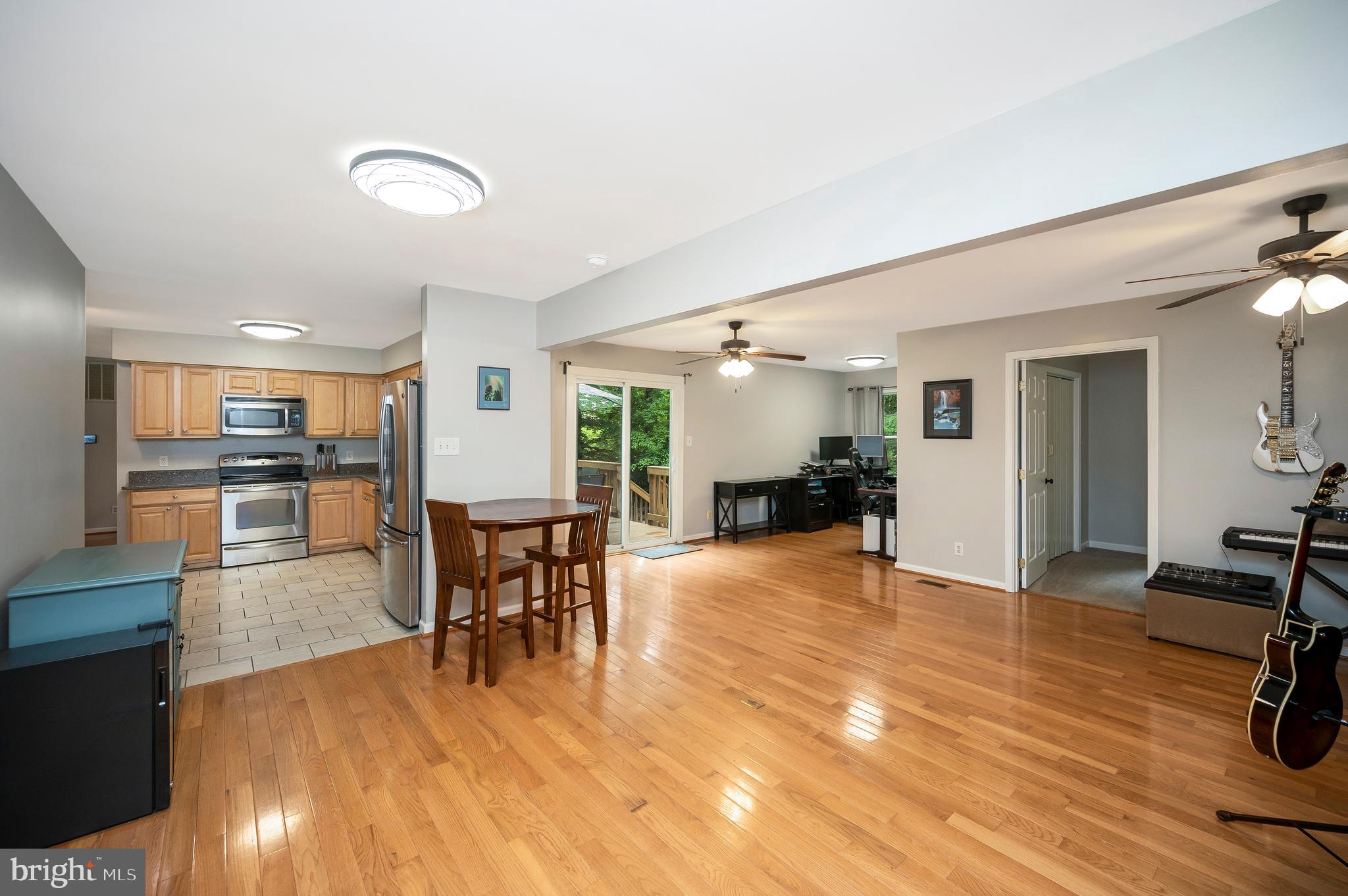 679 Cropp Road Fredericksburg, VA 22406 - Photo 21 of 39 a view of a dining room with furniture kitchen and wooden floor