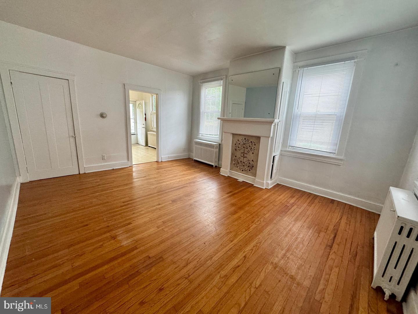 74 South Main Street, Unit A Mullica Hill, NJ 08062 - Photo 3 of 4 an empty room with wooden floor and windows