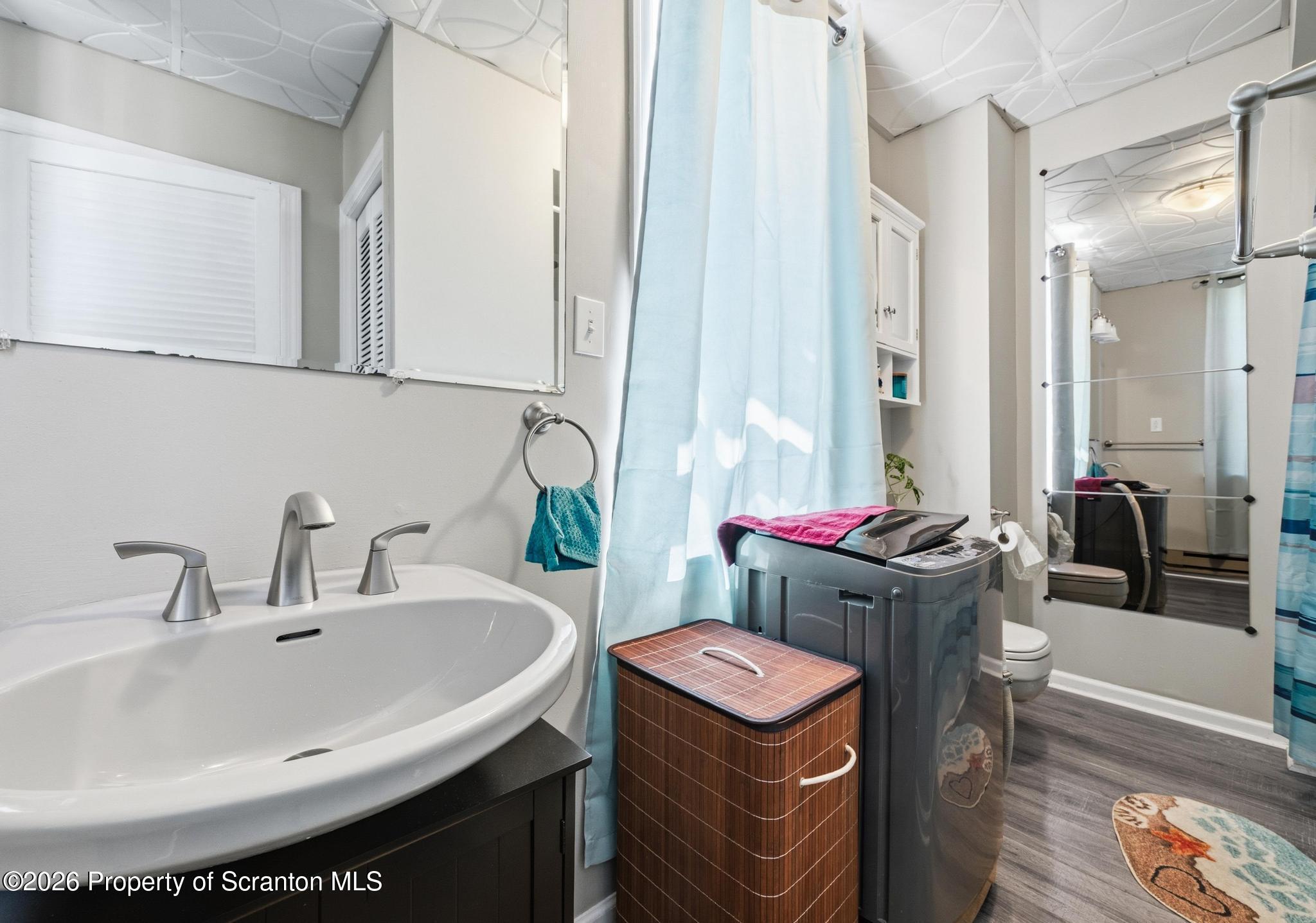 518 Prospect Avenue Scranton, PA 18505 - Photo 50 of 59 a bathroom with a sink and a mirror